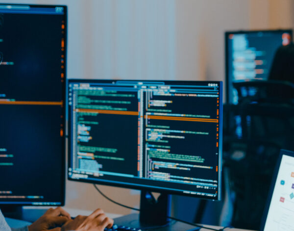 Group Adult Asia male, female freelance typing write prompt AI bot IT app smart program nomad, video game, terminal with coding language, designer, big data center on desktop computer in night office.