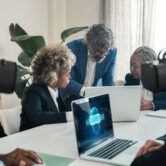 Multiracial business people using virtual reality goggles work inside metaverse cyberspace - VR lifestyle technology concept - Focus on senior man face