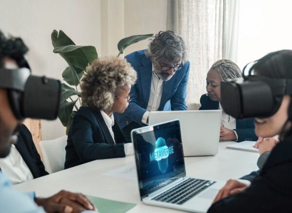 Multiracial business people using virtual reality goggles work inside metaverse cyberspace - VR lifestyle technology concept - Focus on senior man face