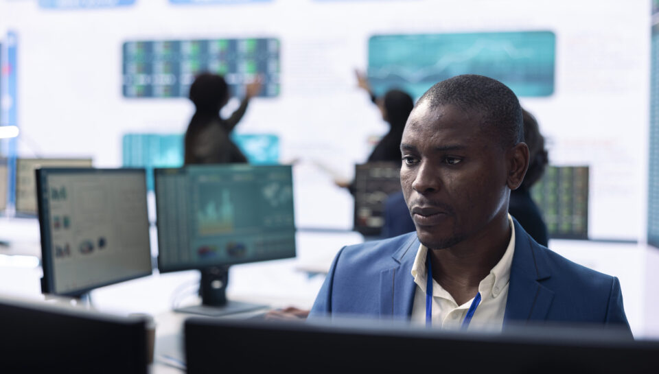 Business analyst looking into statistics and reports to detect any obstacles Business analyst looking into statistics and reports to detect any obstacles within the project structure, preparing solutions to ensure productivity. Manager studies firm numbers.